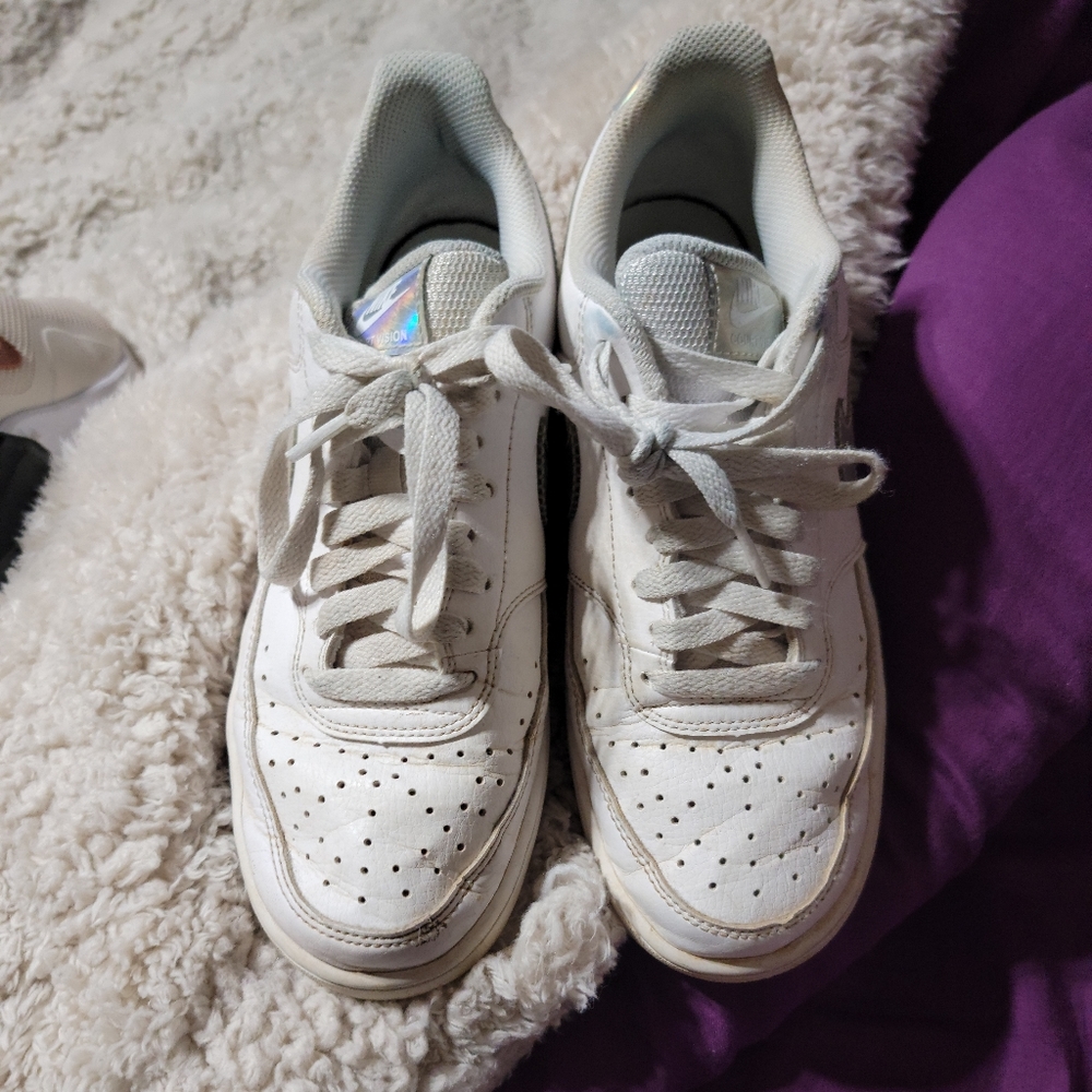 Silver and white Nikes